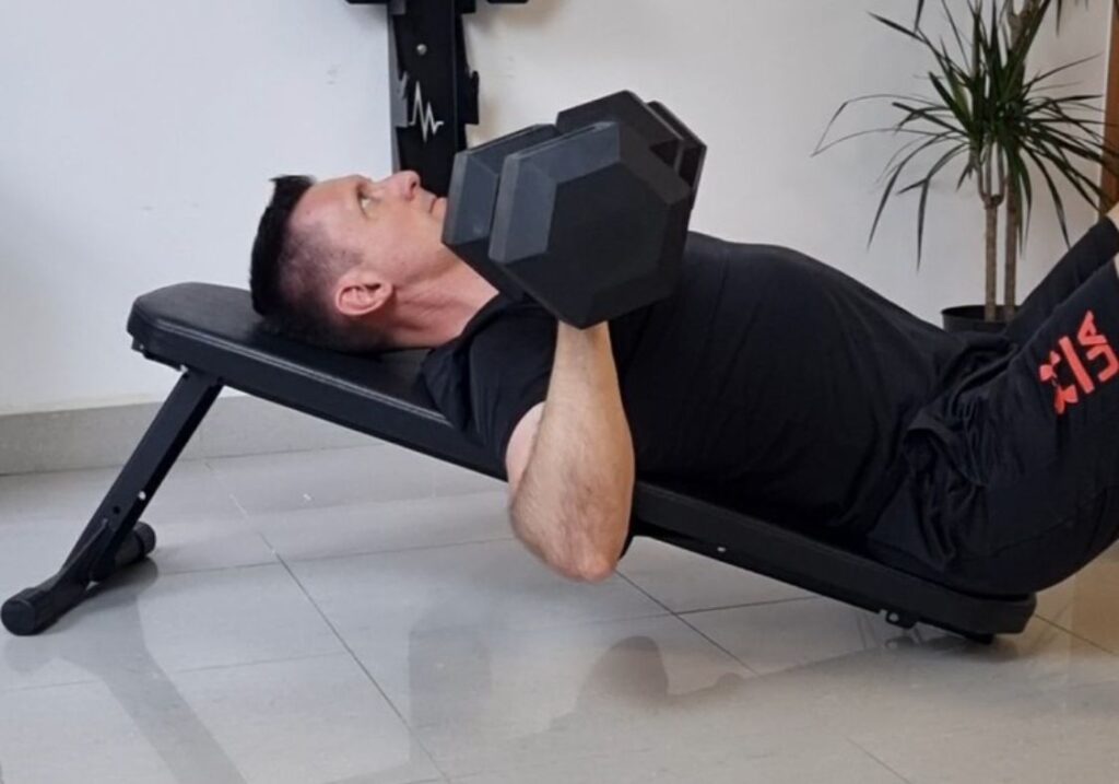 men doing incline bench press on flat foldable weight bench