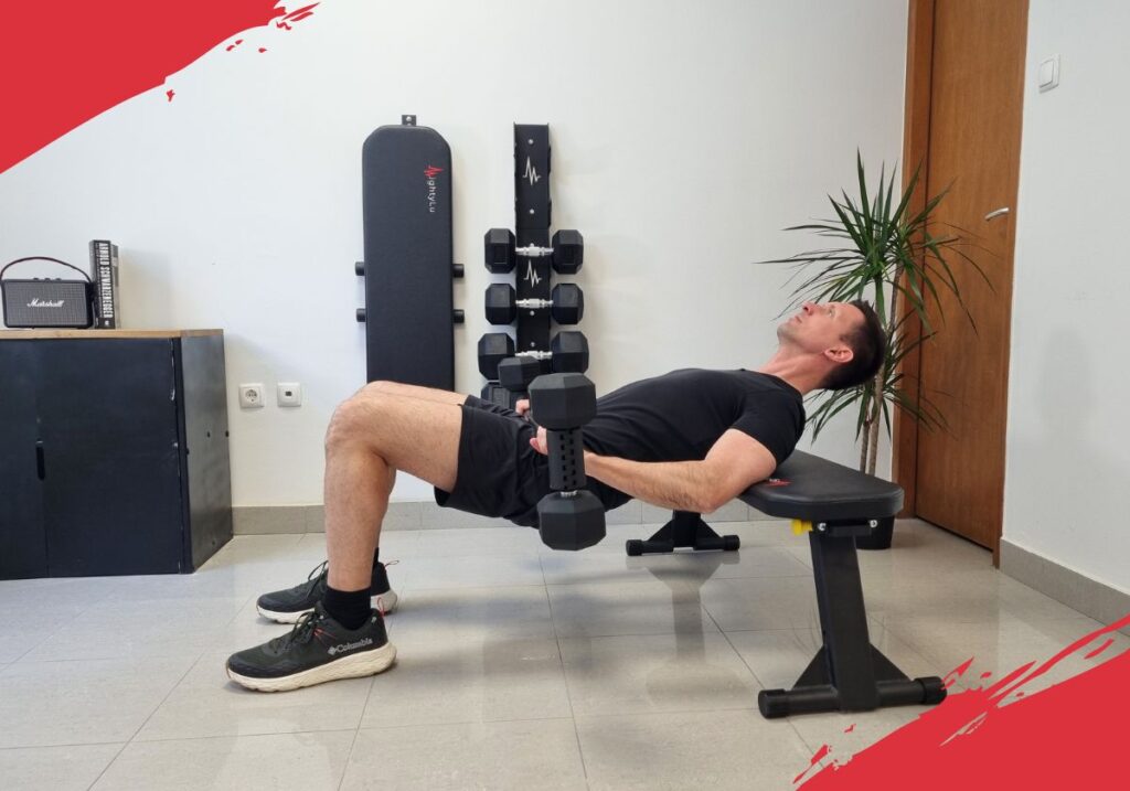 Glute bridge exercise being performed with an dumbbell to barbell converter and weight bench
