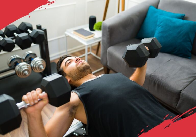 man doing dumbbell press on weight bench at home