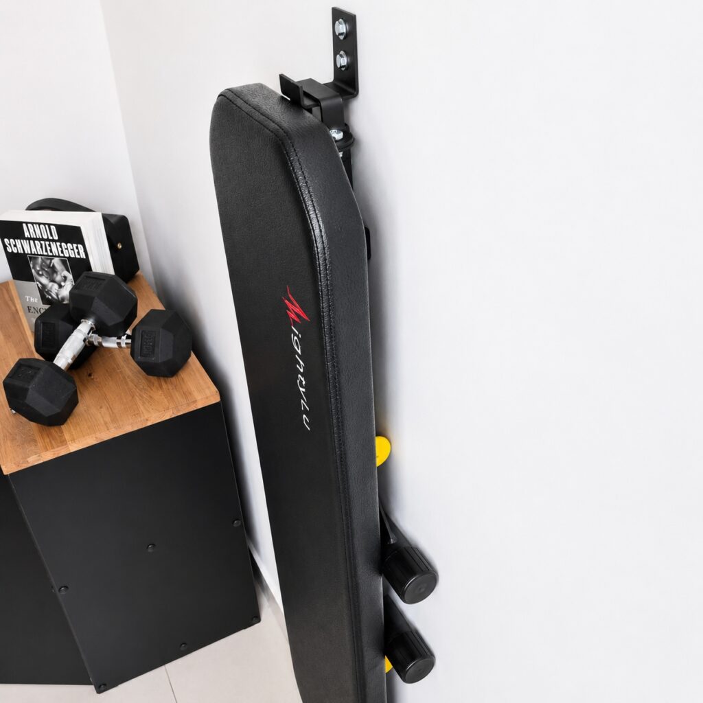 MightyRock foldable weight bench hung on the wall
