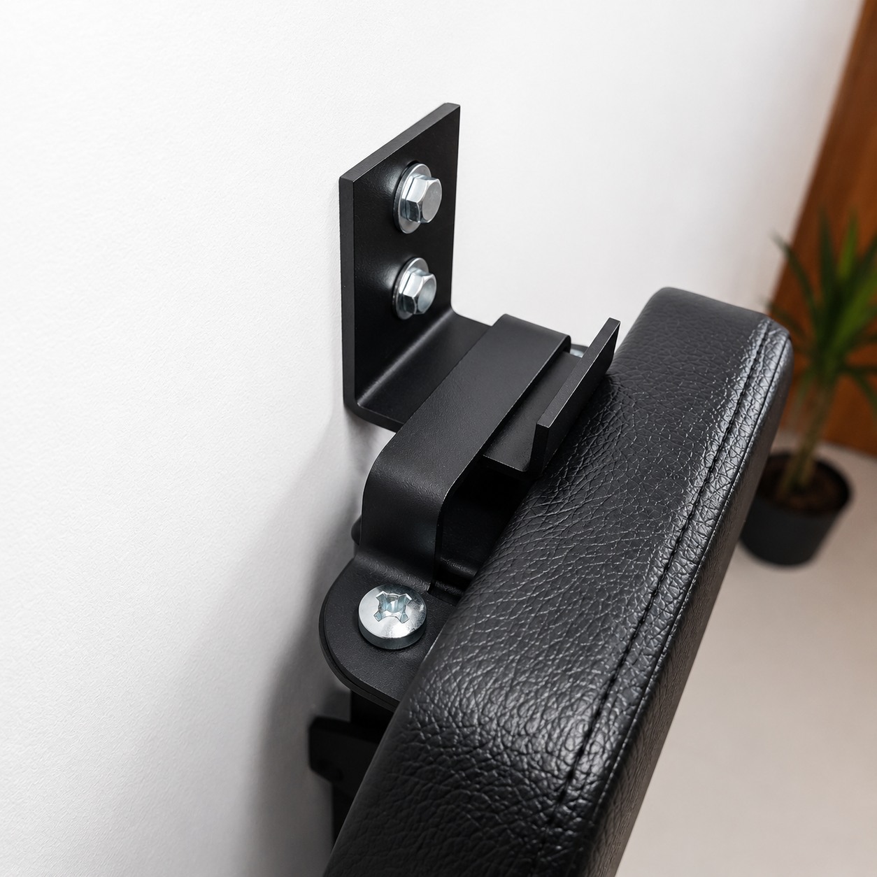 MightyRock bench in studio wall hanging braclet MightyRock foldable weight bench hung on the wall detailed view of the braclet