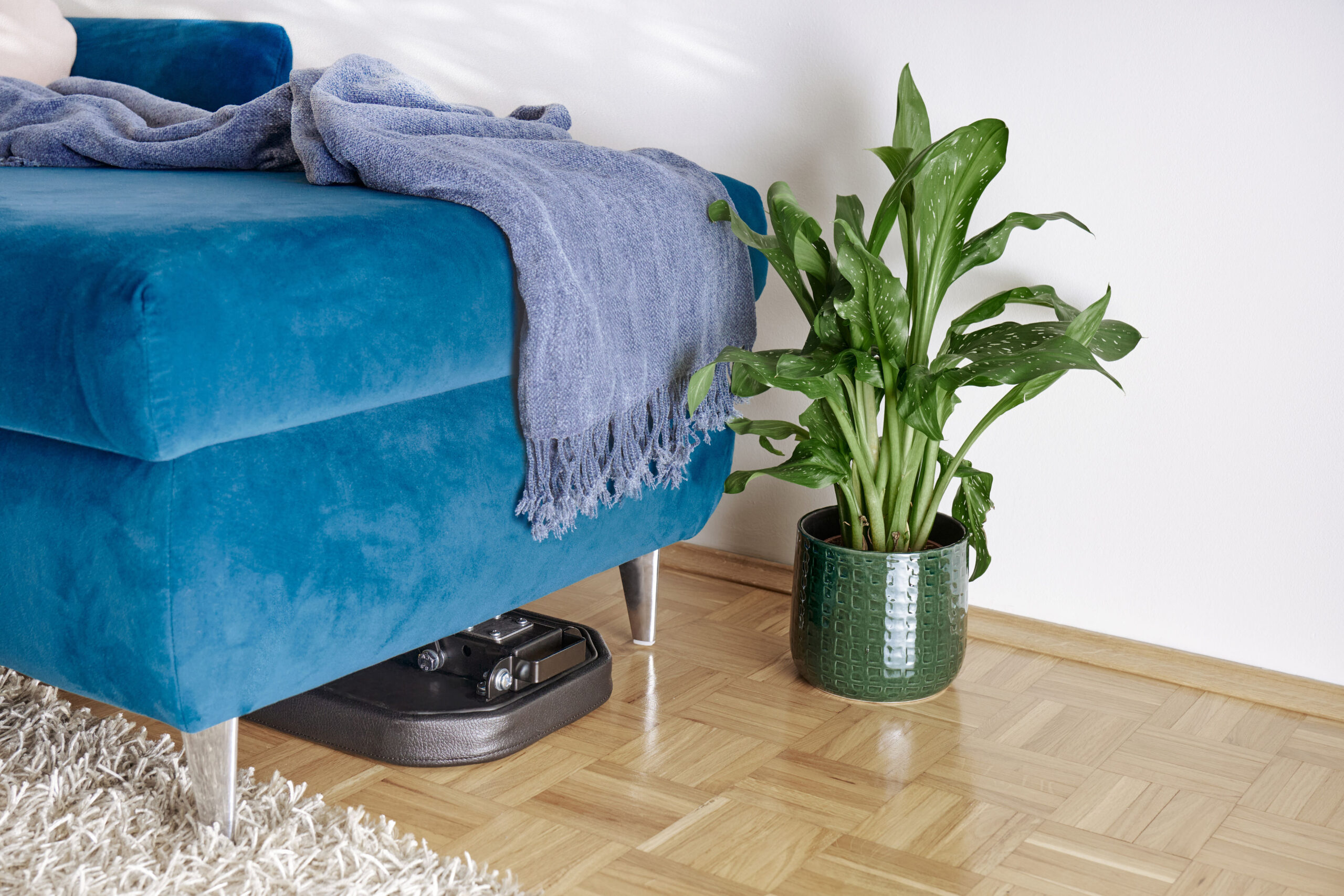 MightyRock foldable weight bench stored under a sofa